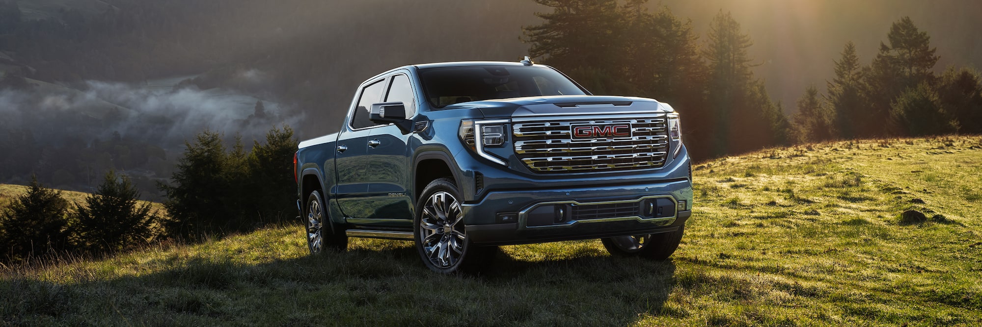 2026 GMC Sierra 1500 on sunny grassy hill