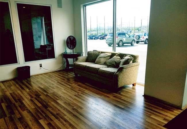 A bright room showcasing a stylish couch positioned near a window, enhancing the inviting atmosphere.